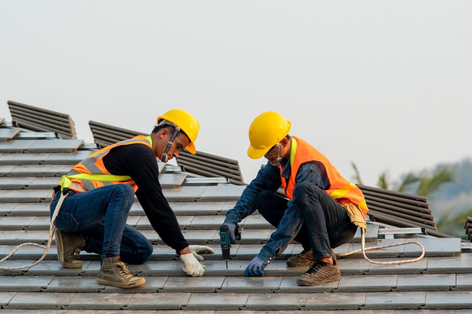 Construction worker wearing safety harness belt during working